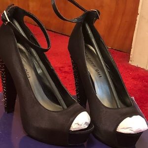 Black satin heels with studs and beads on heels
